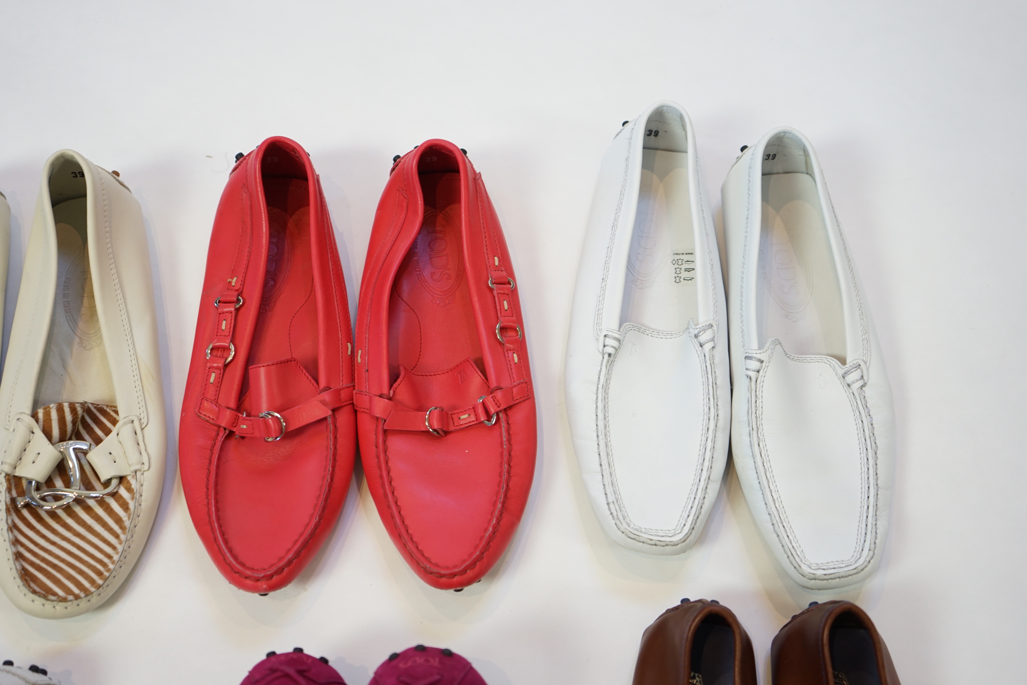 Six pairs of lady's Tod's loafers in a variety of styles and colours, size EU 39